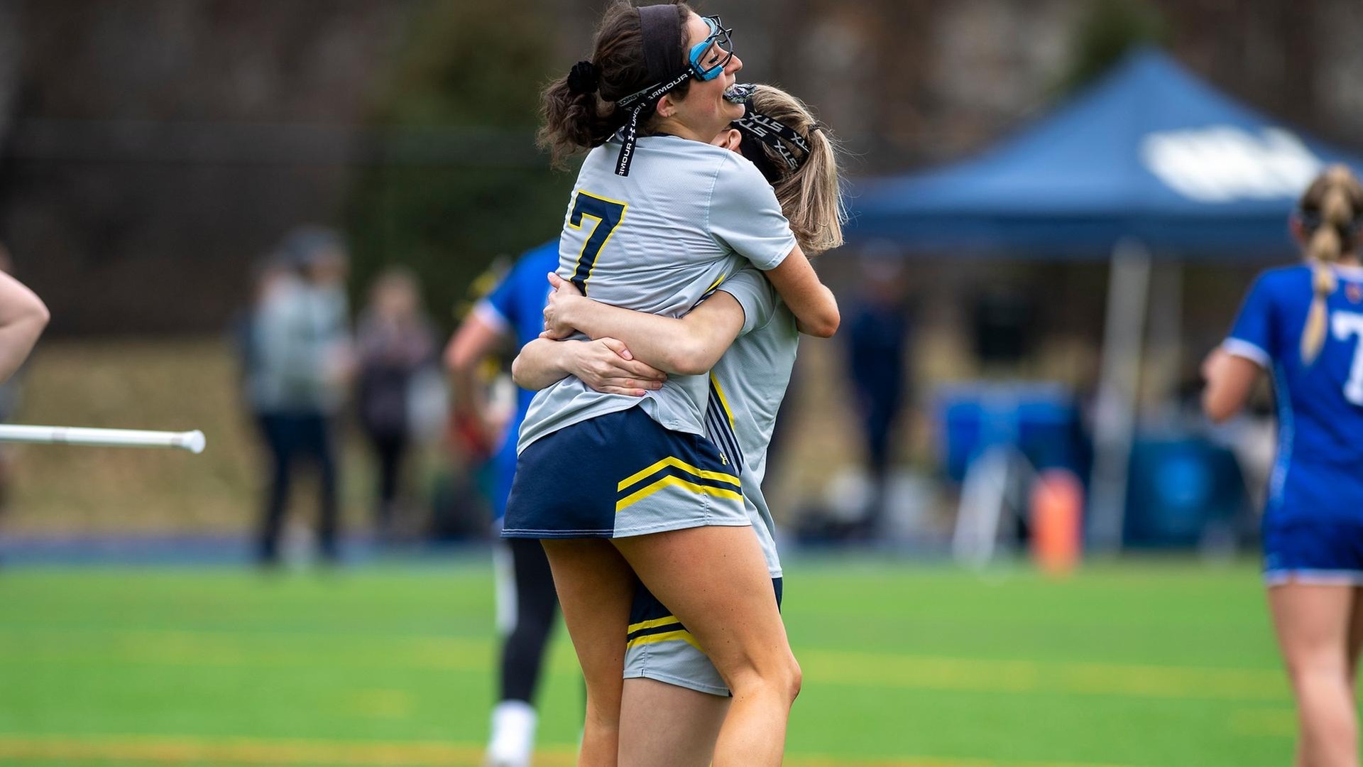 Dinger, Nogueira, Rhoades Lead Women's Lax in Win Over Rivier